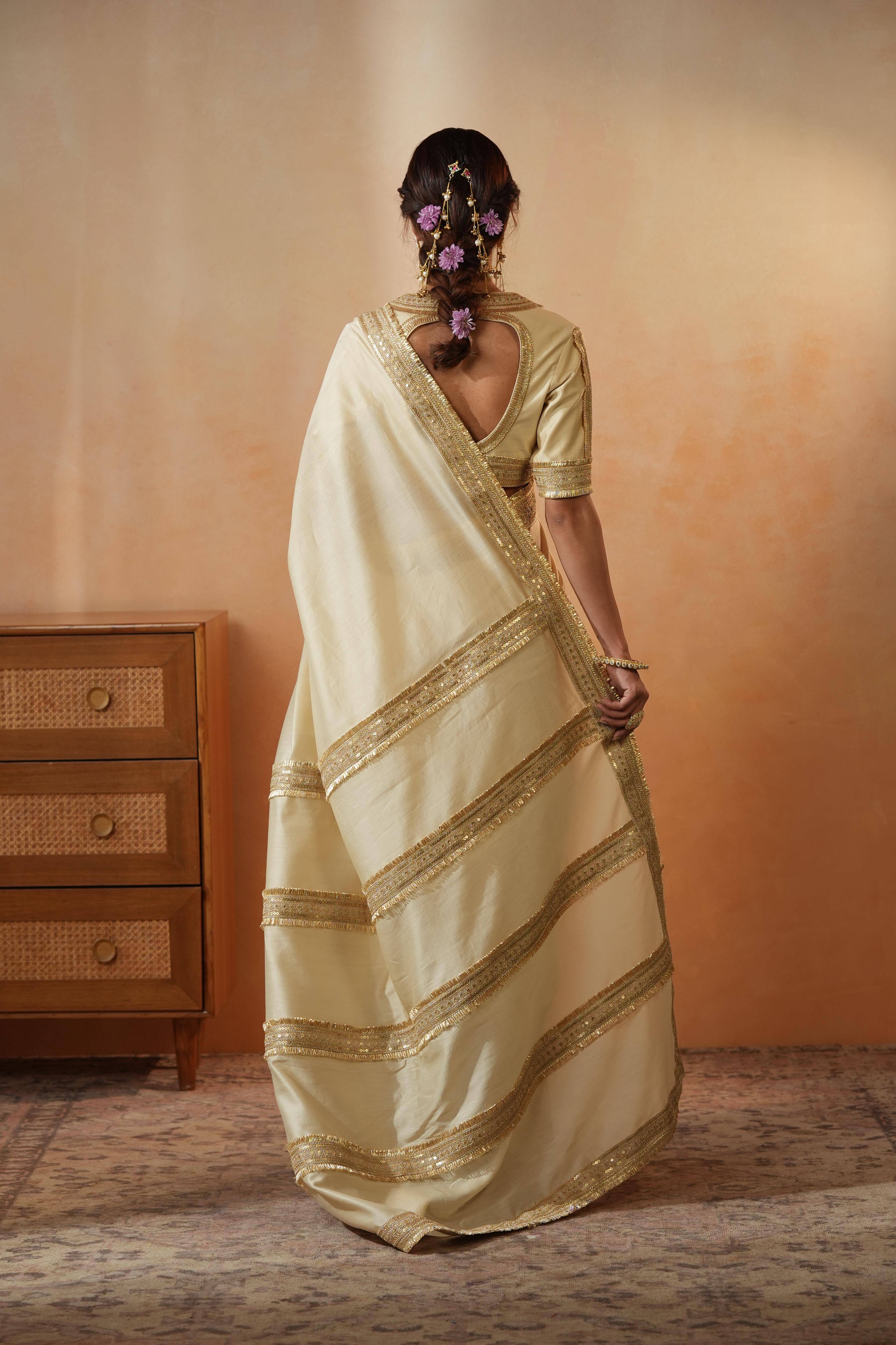 Trisha Beige Border Saree