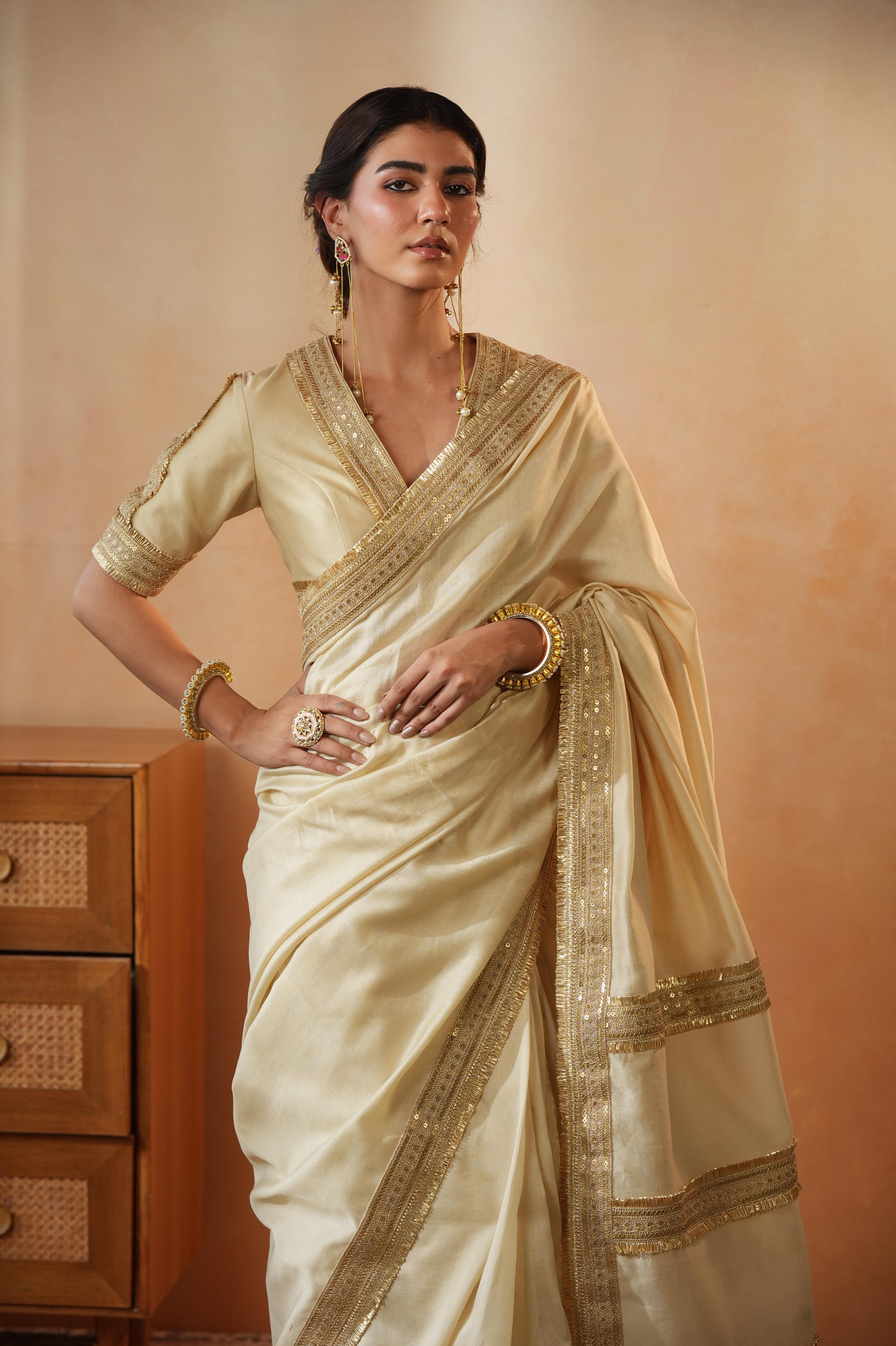 Trisha Beige Border Saree
